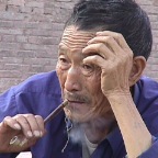Older Man Having A Smoke