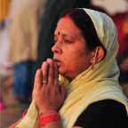 Woman In the Ganges Praying